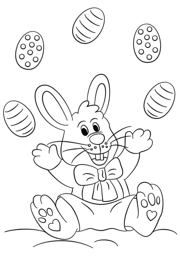 Dibujo de Conejo de Pascua Jugando con Huevo para Colorear
