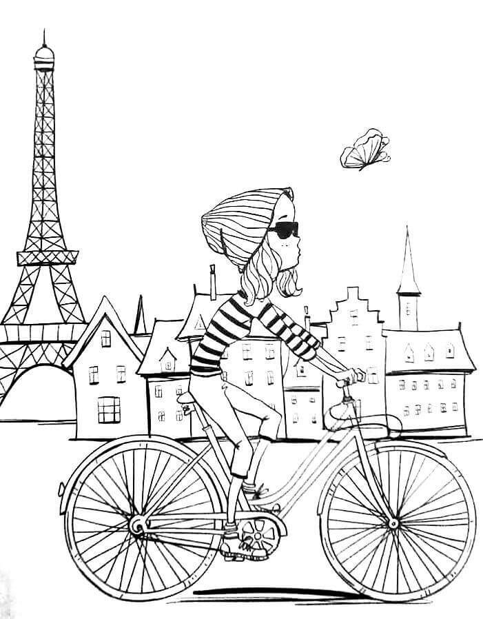 Dibujo de Chica en Bicicleta en la Ciudad de Paris para Colorear